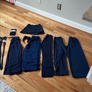 Lot of Girls 8-12 Navy uniforms- 5 pants, 1 skort, 3 ties, 1 headband, 1 tights
